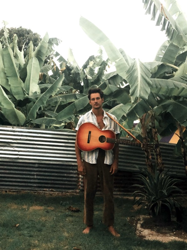 Micah Kolk with guitar